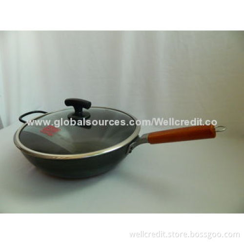 Carbon steel wok with wooden handle